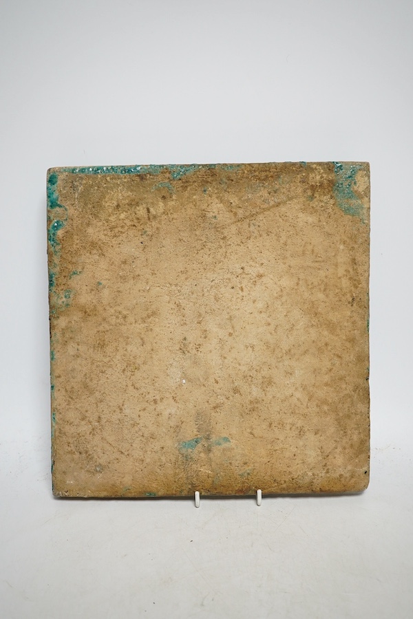 A large Persian turquoise and black tile of a female archer mounted on a horse, 26cm x 27cm. Condition - some pitting in manufacture and small crack to the edge